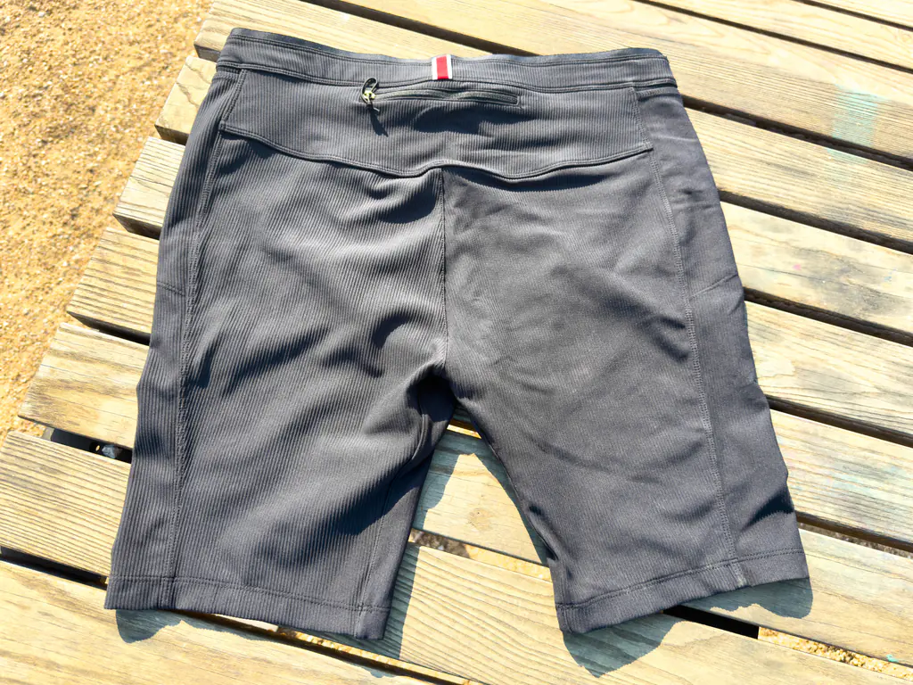 A top down view of the rear of the half tights, with the small zippered rear pocket visible. A top down view of the rear of the half tights, with the small zippered rear pocket visible.