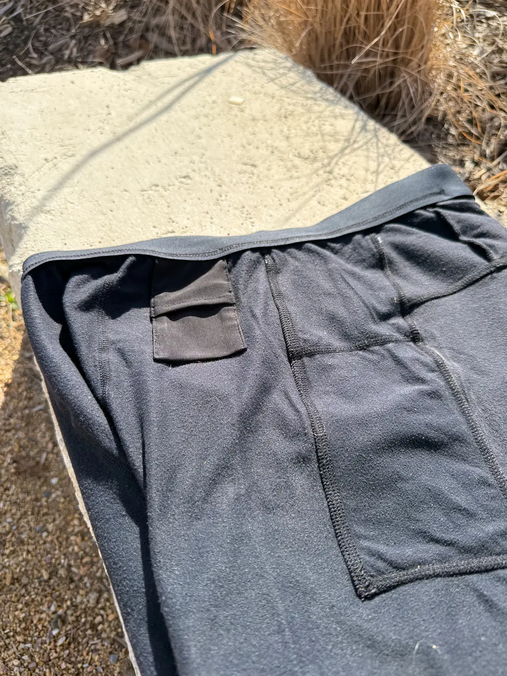 A shot of the pocket construction on the interior of the half tights, showing the flat seams as well as the small key pocket on the waistband A shot of the pocket construction on the interior of the half tights, showing the flat seams as well as the small key pocket on the waistband