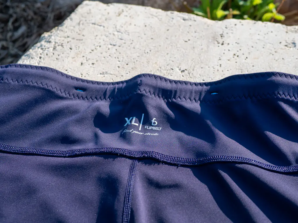 A closeup of the inside of the rear waistband, showing the XL size label