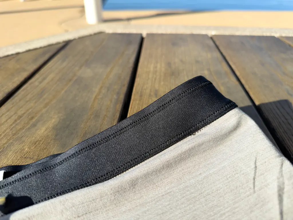 A closeup of the interior of the waistband, showing how the slightly stiffer waistband fabric joins to the liner. A closeup of the interior of the waistband, showing how the slightly stiffer waistband fabric joins to the liner.