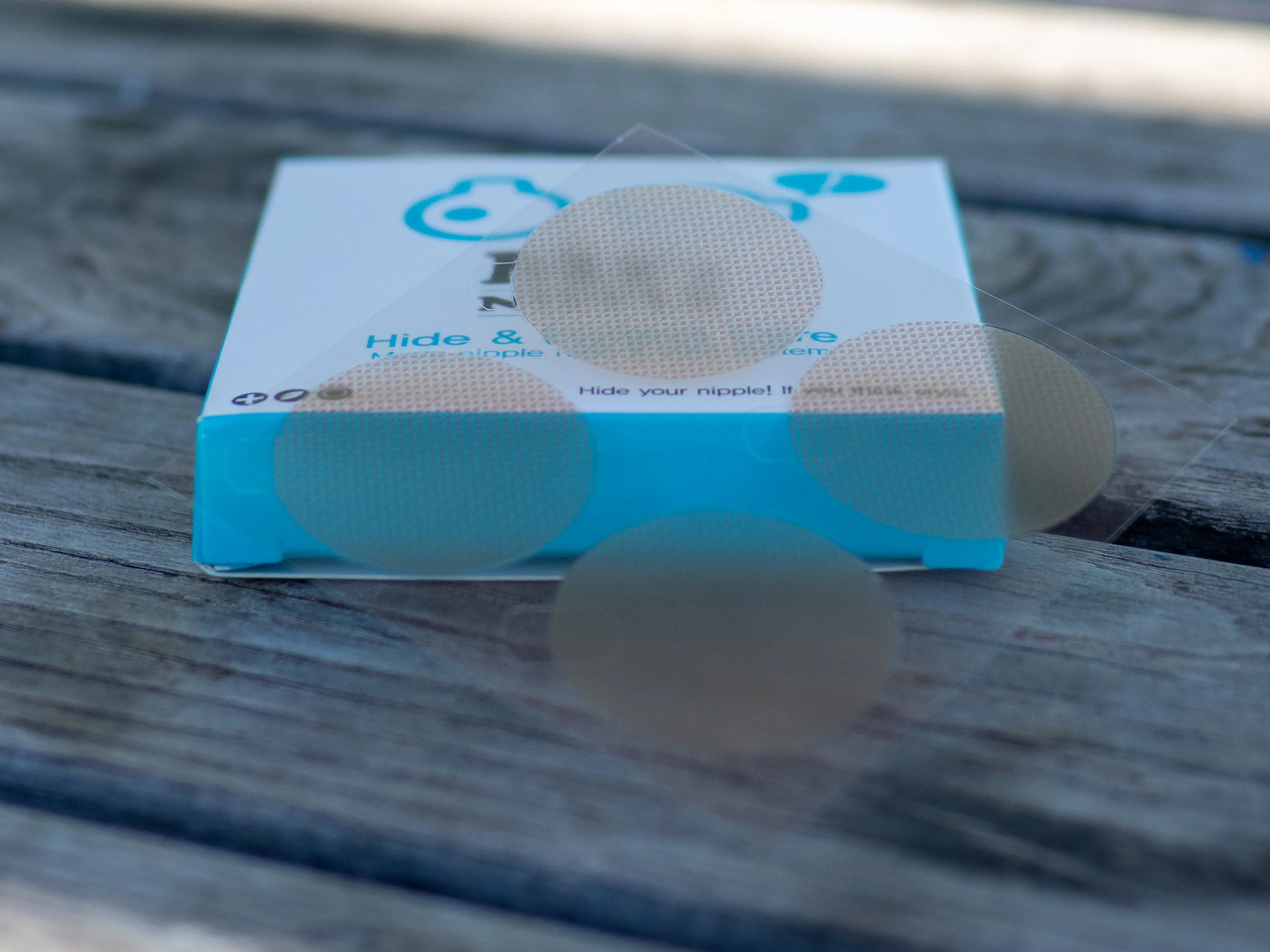 A closeup of the Mr. Nipple Hide and Protect, showing a semi-clear, thin plastic-like round cover. A closeup of the Mr. Nipple Hide and Protect, showing a semi-clear, thin plastic-like round cover.