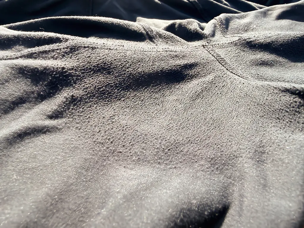 A closeup of the pilling, showing how the fabric is almost harder or solidified in this area A closeup of the pilling, showing how the fabric is almost harder or solidified in this area