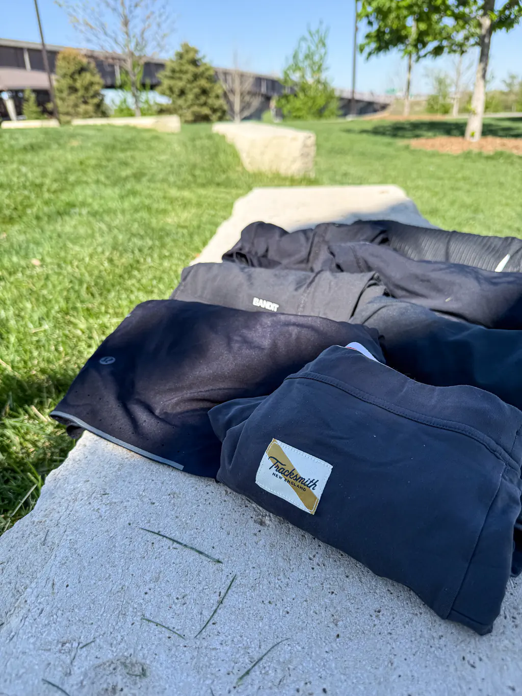 A variety of half tights, rolled up and sitting on a rock bench A variety of half tights, rolled up and sitting on a rock bench