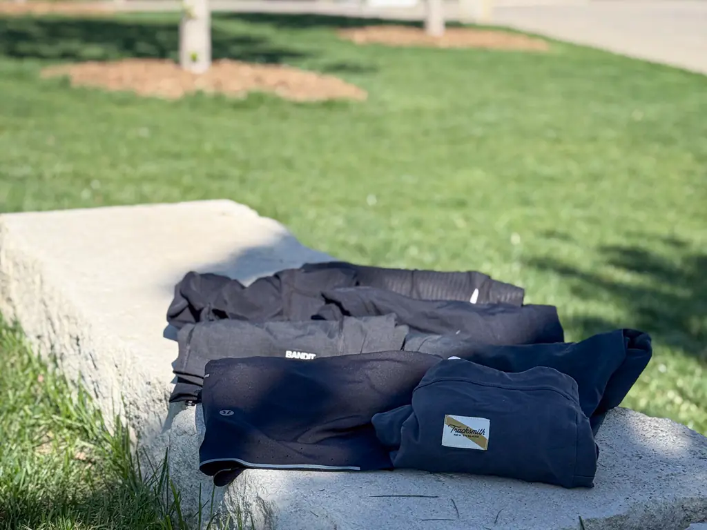 A variety of half tights sitting on a rock bench, all rolled up A variety of half tights sitting on a rock bench, all rolled up