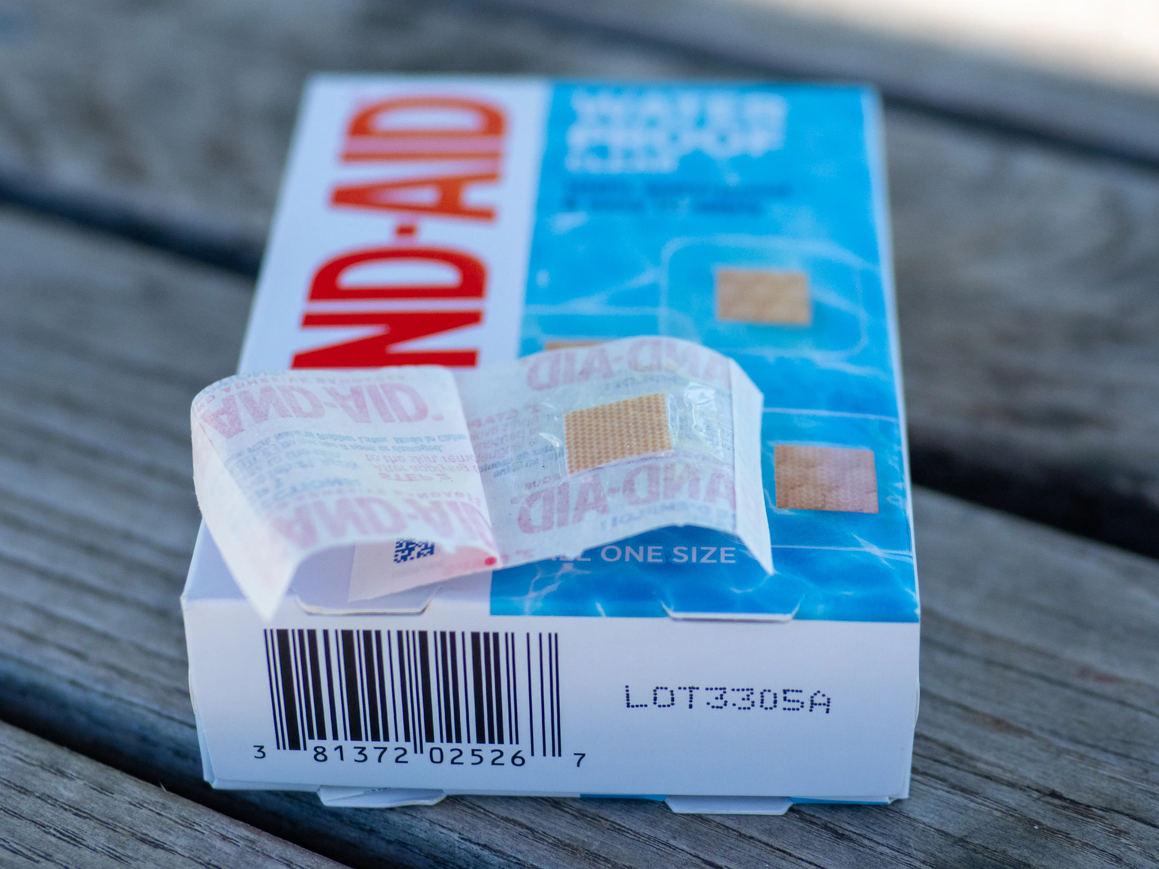 A closeup of the BAND-AID TRU-STAYs unwrapped, showing the square, clear plastic spot bandage. A closeup of the BAND-AID TRU-STAYs unwrapped, showing the square, clear plastic spot bandage.